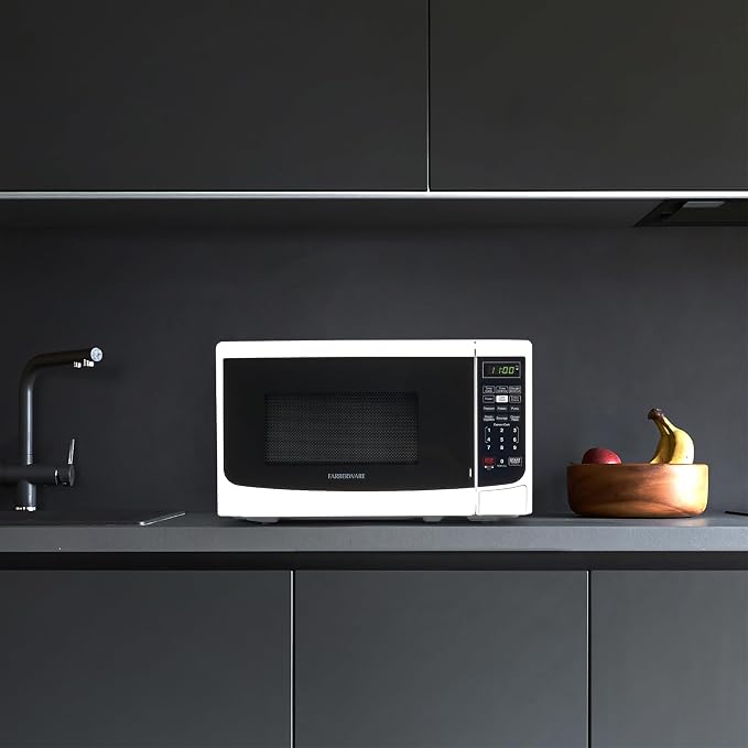 Farberware 0.7 Cu. Ft. Countertop Microwave Oven – 700 Watts Power, Auto Cook Settings, Defrost, Easy Clean and Child Safety Lock - White