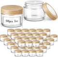 1 oz Glass Jars with Plastic Woodgrain Lids, Bumobum 48 pack Round Clear Cream Jars with Black and White Labels & Inner Liners, Empty Cosmetic Containers for Cream, Lotion, Ointment