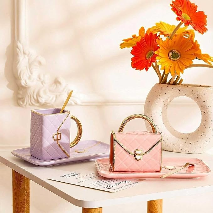 Zubebe 2 Set Coffee Mug Elegant Handbag Shaped Cup Modern Ceramic Purse Mug with Spoon and Saucer, 10oz Cute Creative Tea Cup for Woman Girls Gift (Pink,Purple)