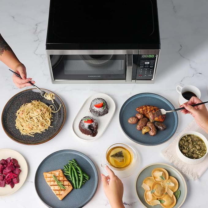 Farberware 0.7 Cu. Ft. Countertop Microwave Oven – 700 Watts Power, Auto Cook Settings, Defrost, Easy Clean and Child Safety Lock - Stainless
